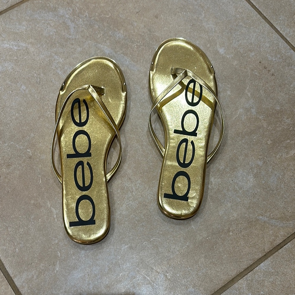 Bebe Gold Flip Flops